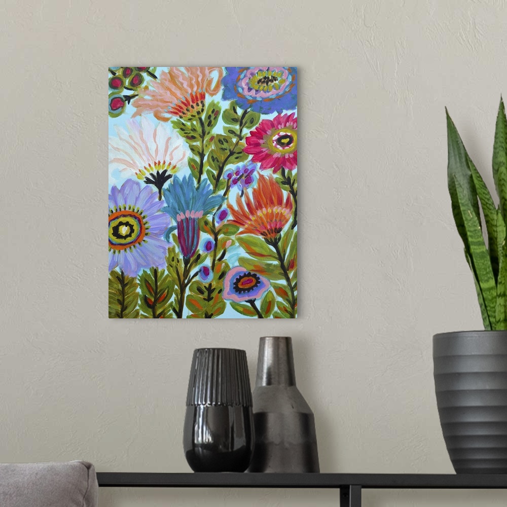 A modern room featuring Colorful contemporary artwork of folk style blooming flowers in a variety of sizes and colors.