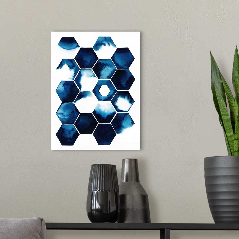 A modern room featuring Tiled honeycomb shapes, each with a dark blue watercolor splash inside.