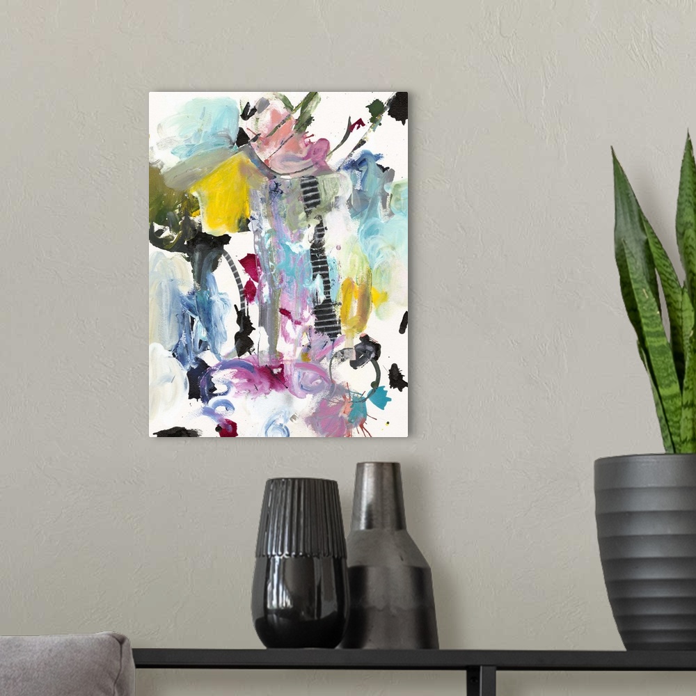 A modern room featuring Abstract painting in wild splashes and splatters of pink, teal, yellow, and black.