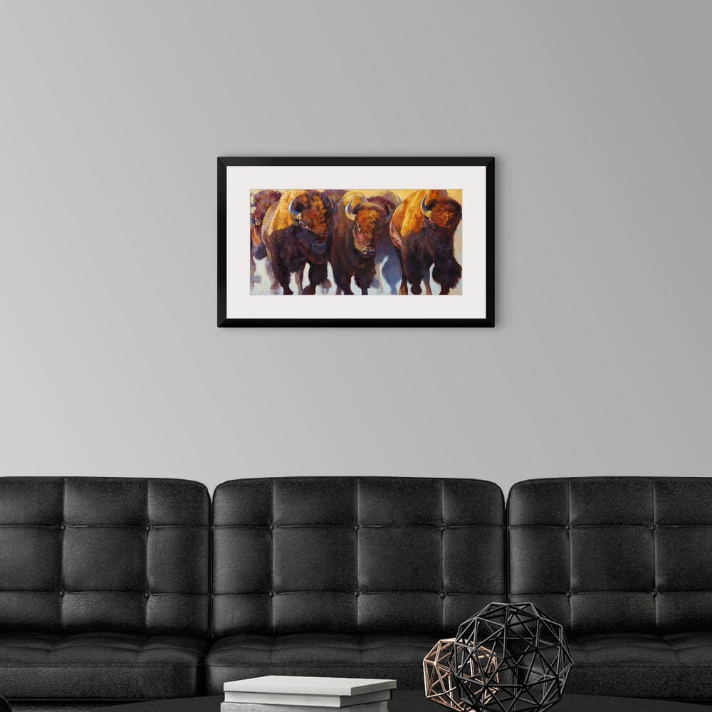 A modern room featuring Painting on canvas of bison and buffalos running in a pack.