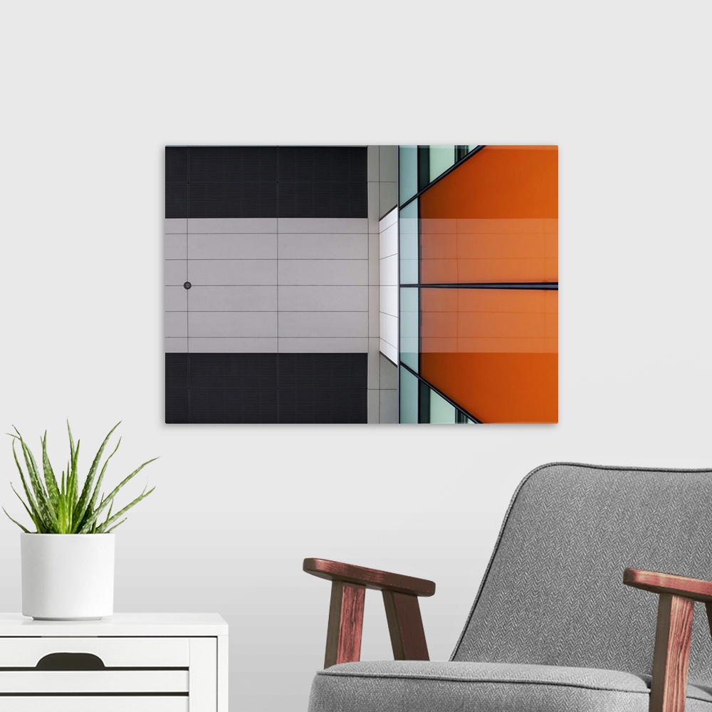 A modern room featuring Orange glass and ceiling panels create an abstract image in Amsterdam.
