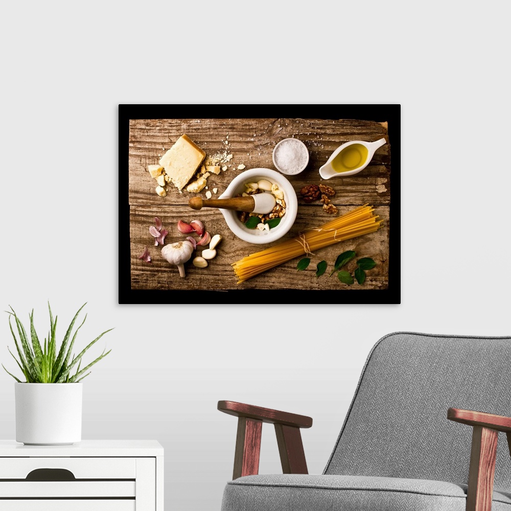A modern room featuring Spread of ingredients for pesto arranged on a wooden board and in a mortar and pestle.