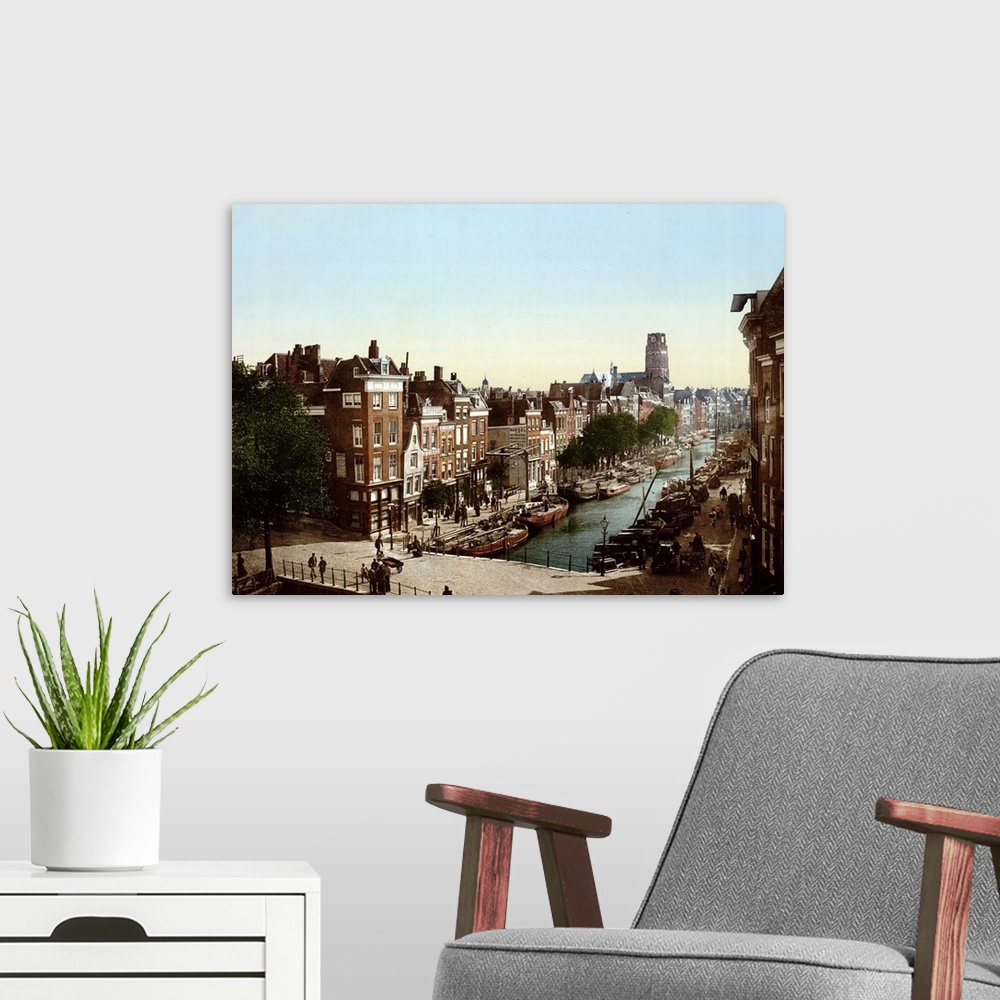 A modern room featuring photomechanical print dated to 1900, depicting; Delft Vaart, Rotterdam.