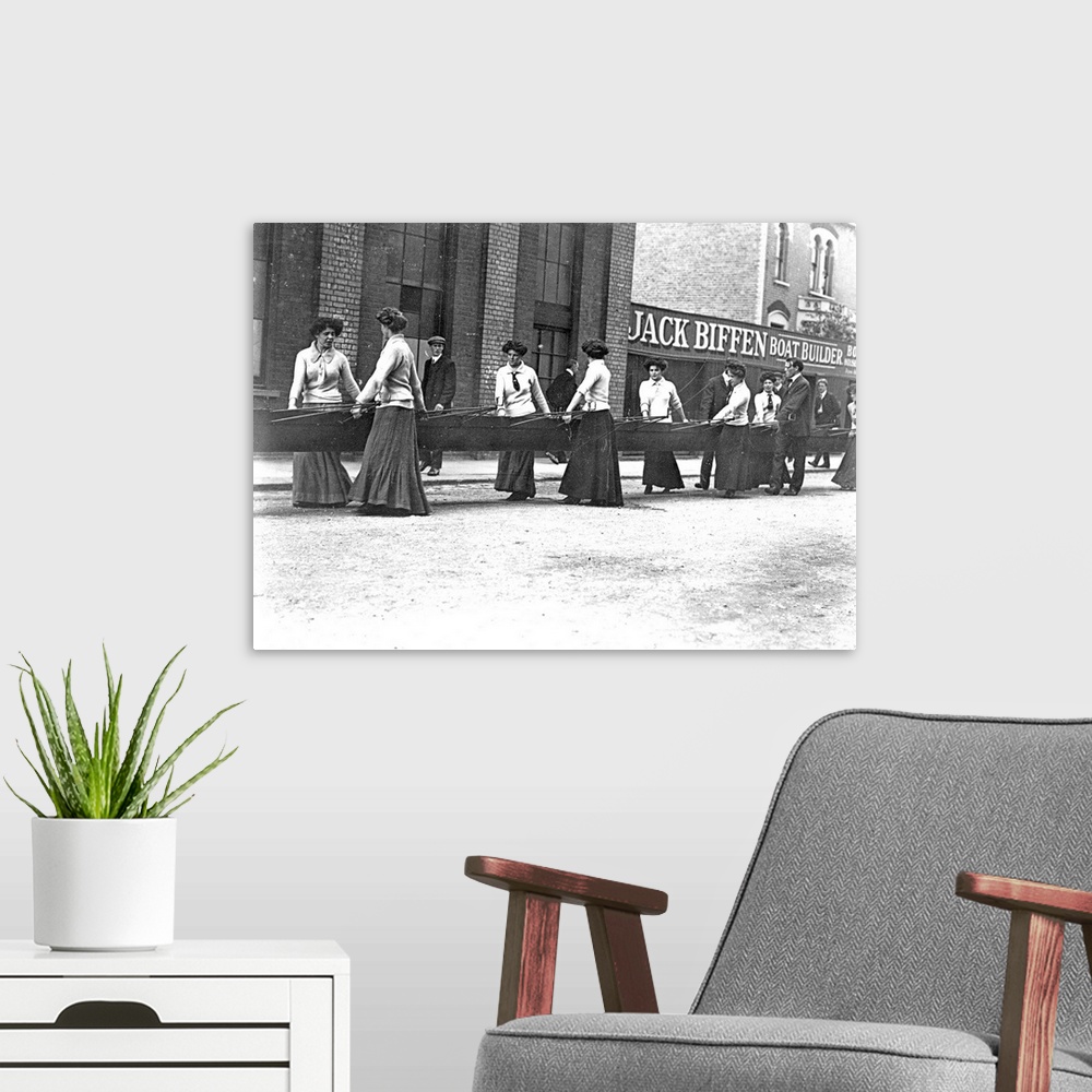 A modern room featuring circa 1907:  The Furnivall Rowing Eight bringing in their boat