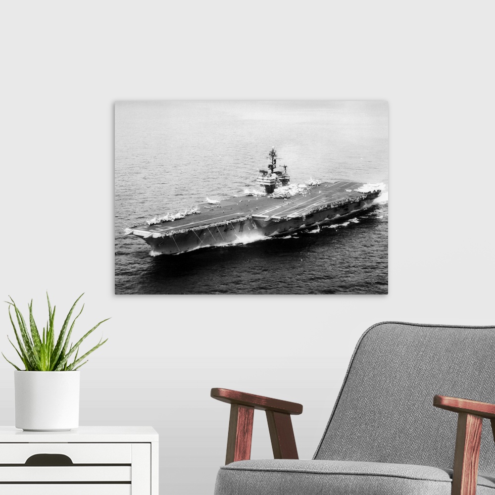 A modern room featuring The 82,000-ton USS Kitty Hawk, one of the largest attack aircraft carriers of the U.S. 7th fleet,...