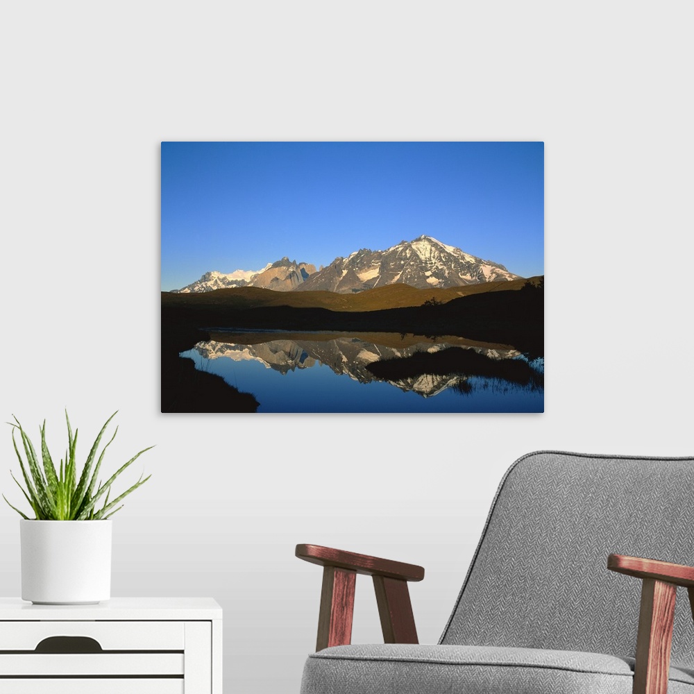 A modern room featuring Chile, Torres Del Paine National Park, Panoramic view of a mountain range around a lake