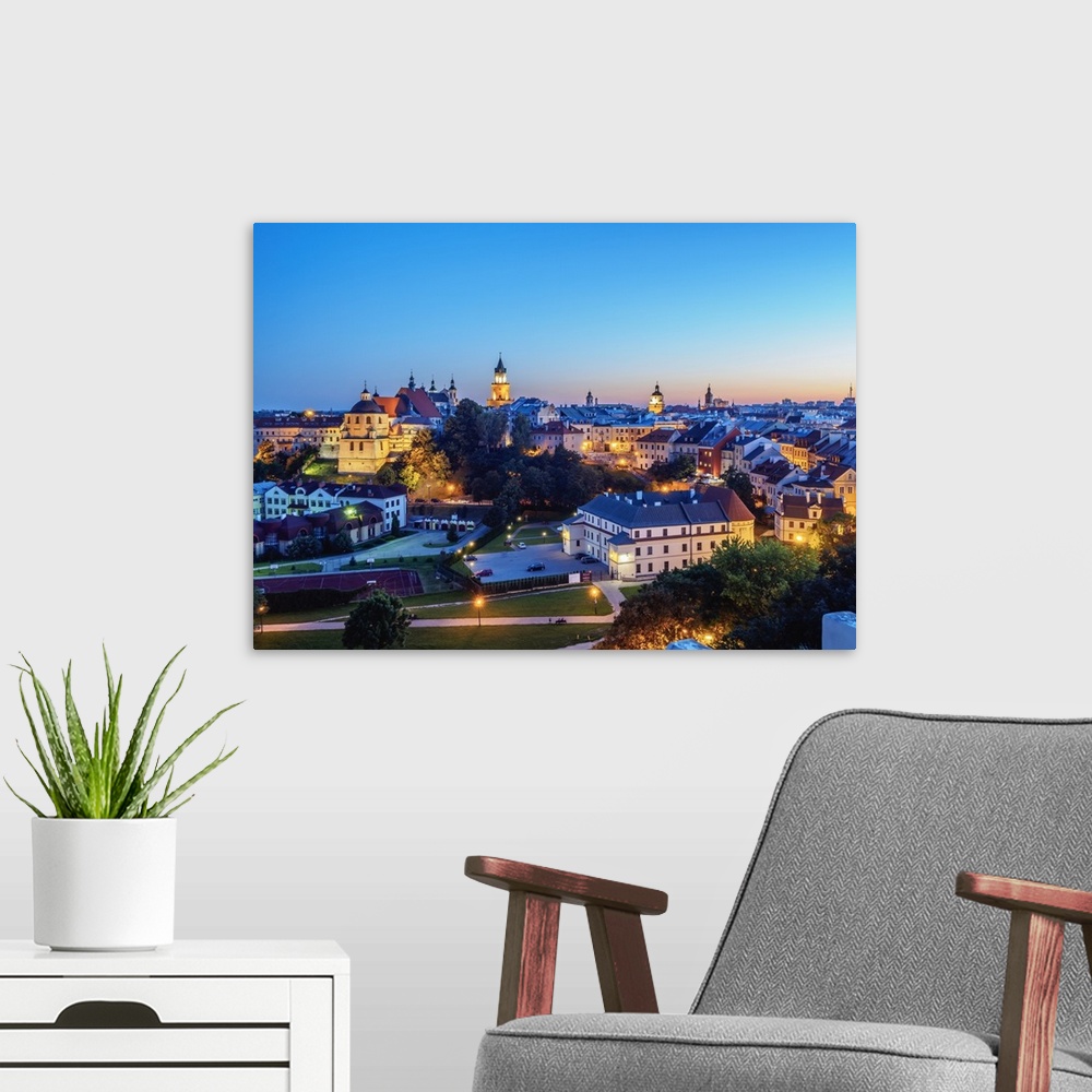 A modern room featuring Old Town skyline at twilight, City of Lublin, Lublin Voivodeship, Poland