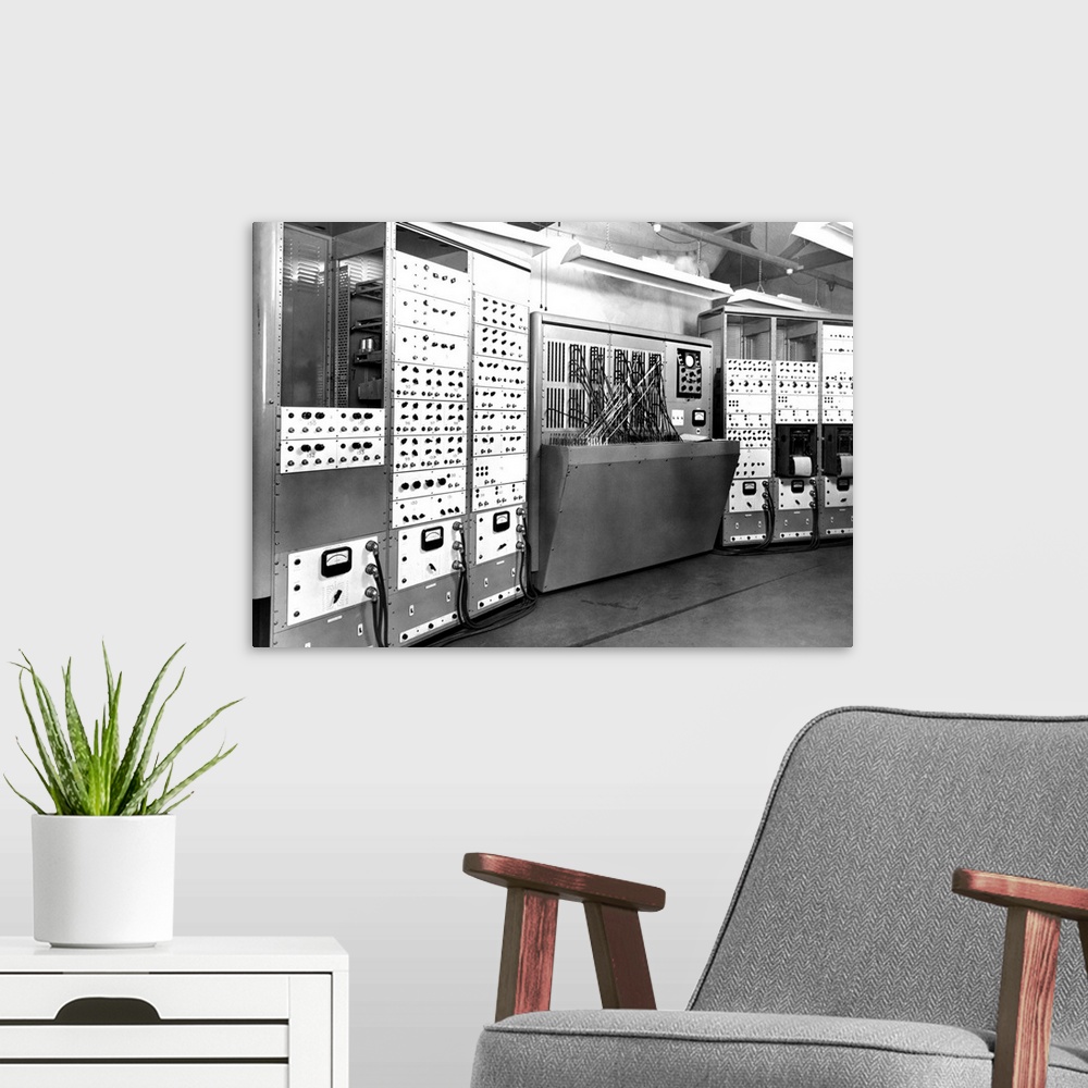 A modern room featuring Electronic simulator. This is the enlarged version of this machine, which was an early form of co...