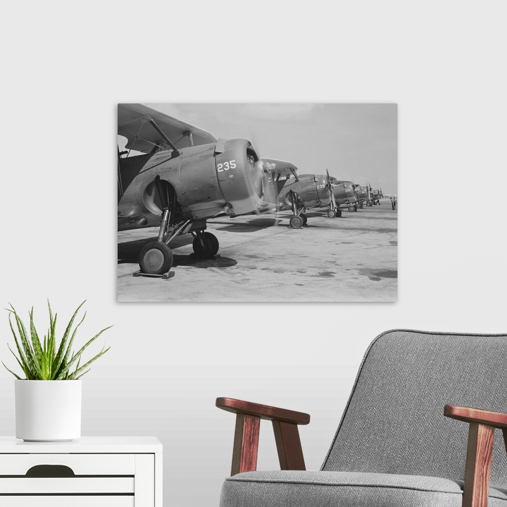A modern room featuring August 1942 - Naval air base, Corpus Christi, Texas. Lined up and looking eager for flight are Na...