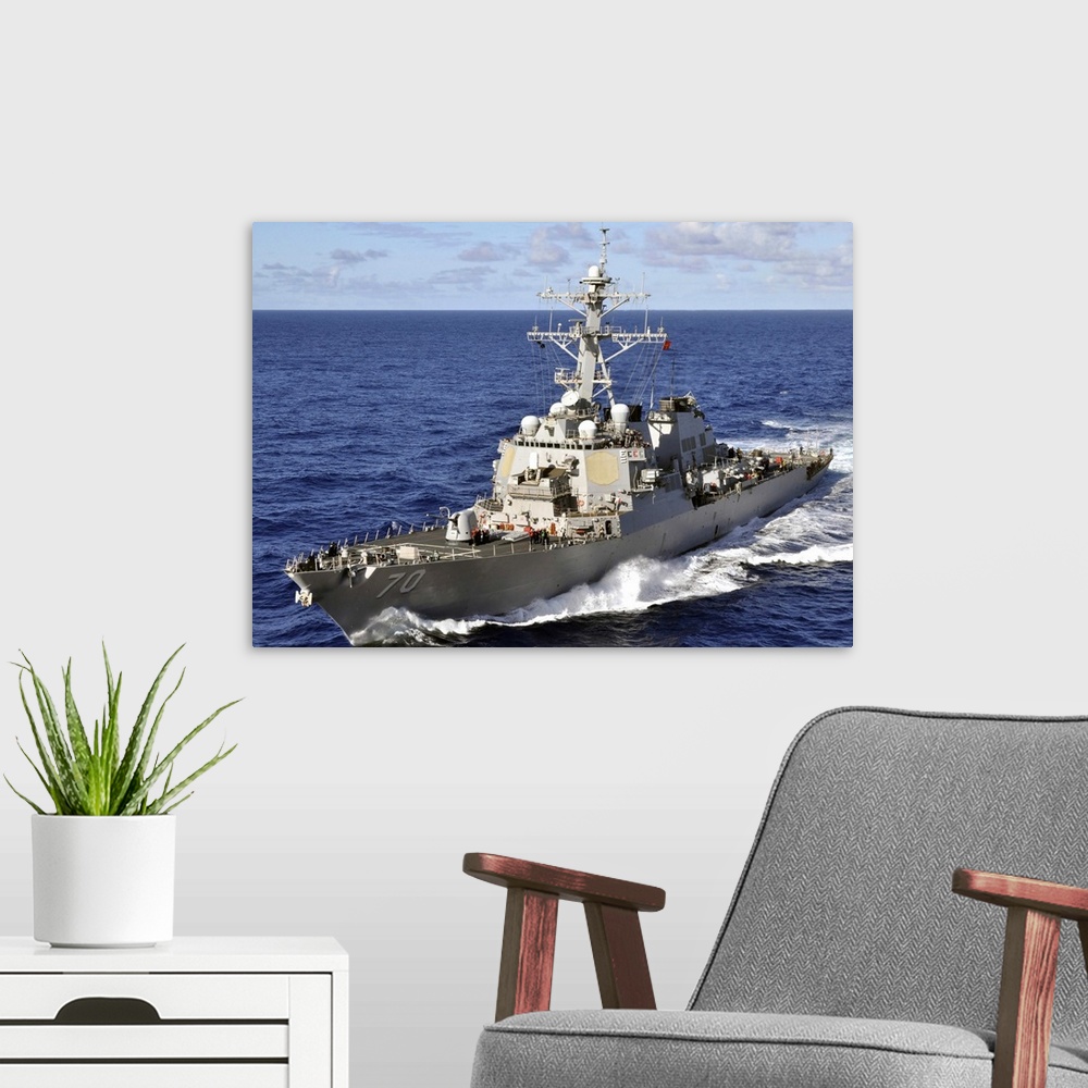 A modern room featuring Guided-missile destroyer USS Hopper underway in the Pacific Ocean.