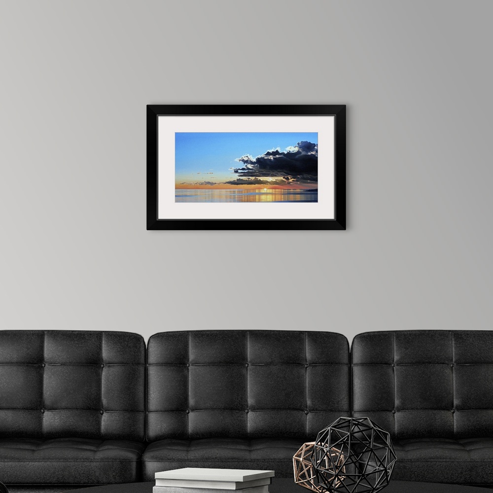 A modern room featuring Contemporary painting of a seascape with dark clouds rolling in.