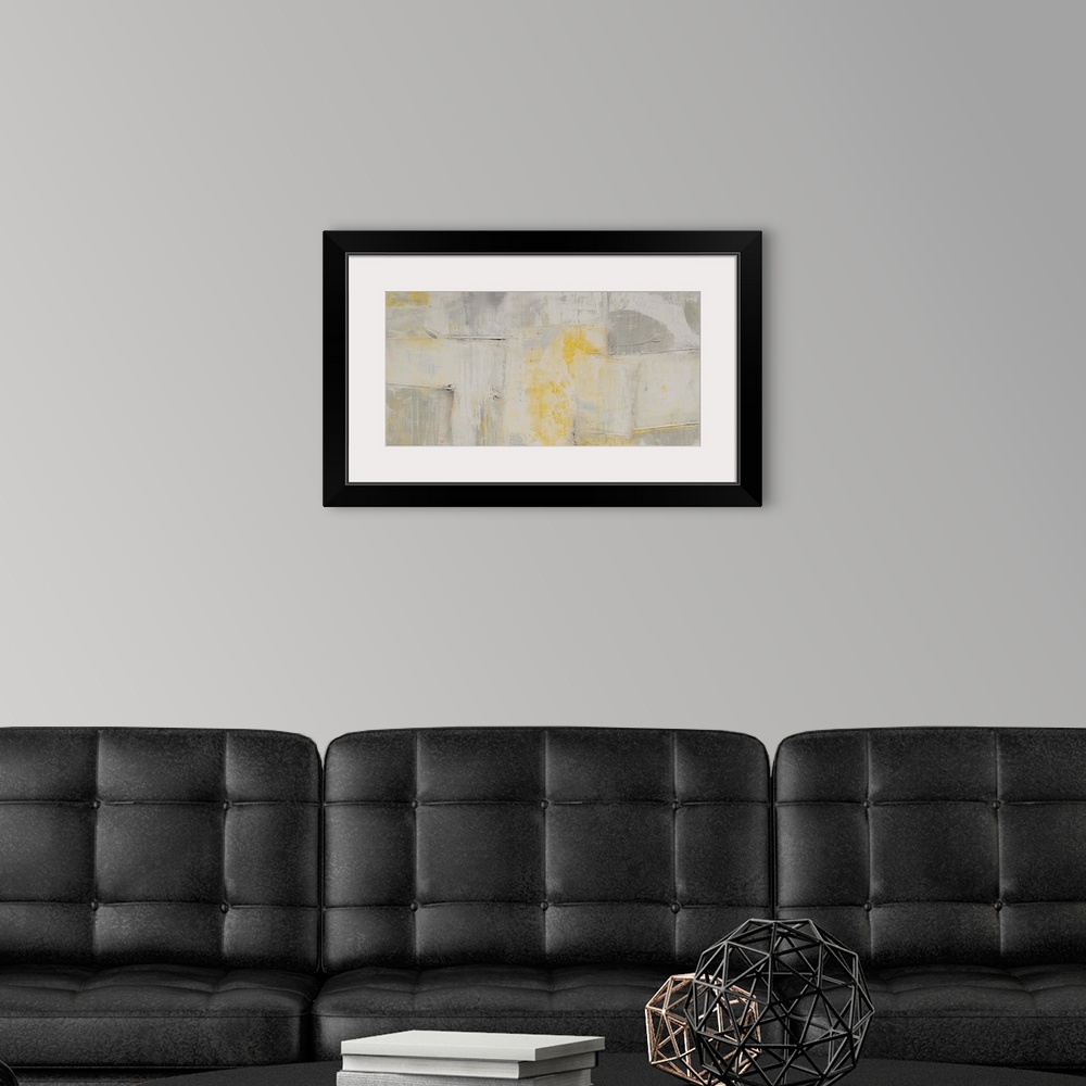 A modern room featuring Contemporary abstract artwork in pale, muted shades of grey and yellow.