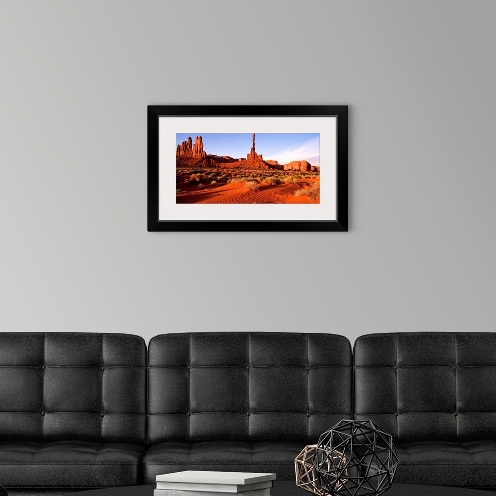 A modern room featuring The bright red sands and rock formations of Monument Valley, Arizona.