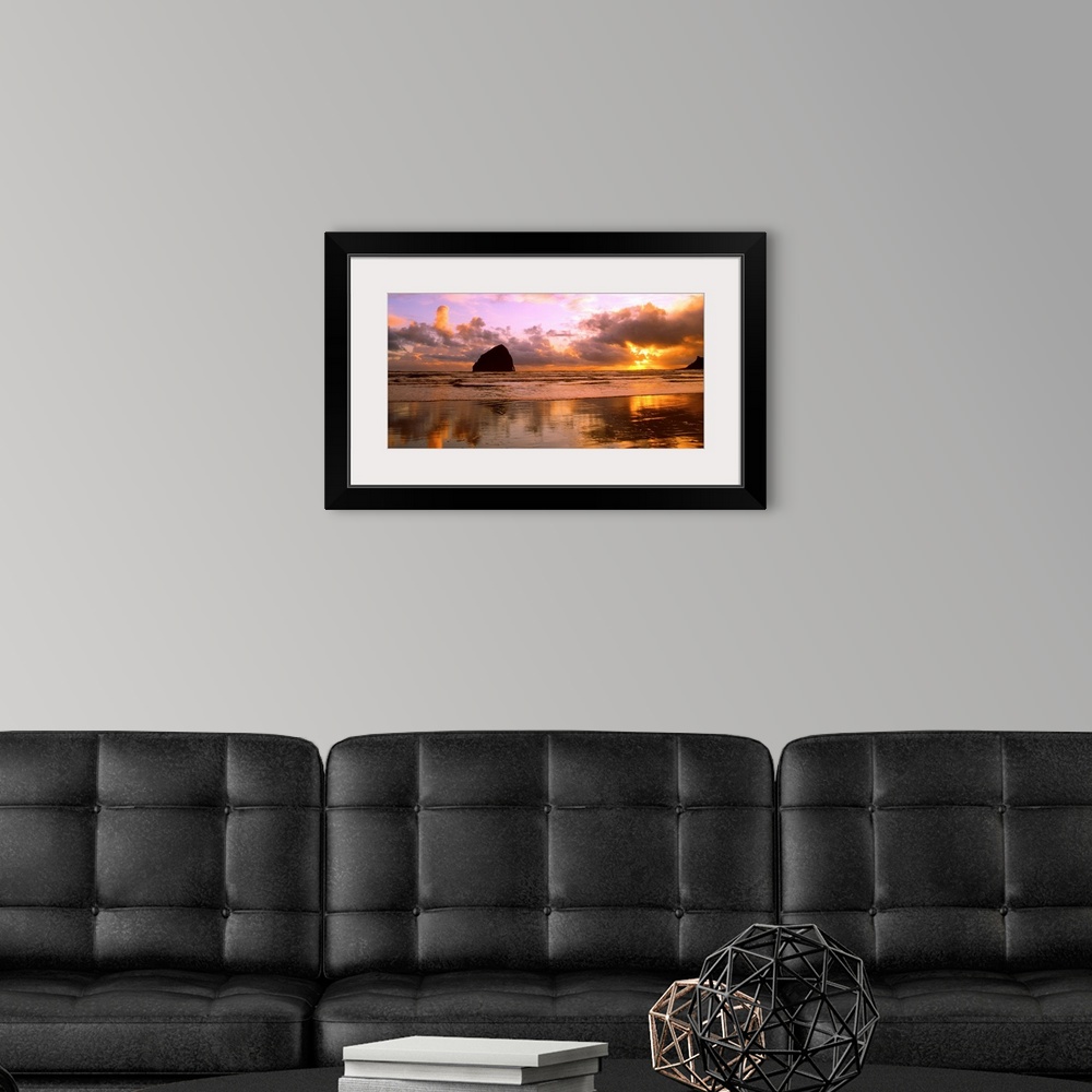 A modern room featuring Sea stacks on the beach silhouetted at sunset, Pacific City, Oregon.