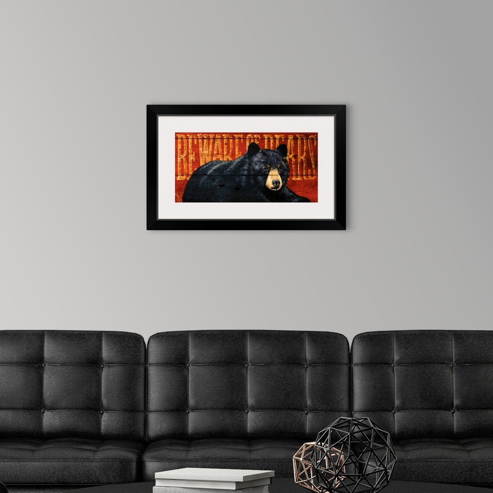 A modern room featuring Artwork of a black bear sitting on the ground with the warning ""Beware of Bears"" written behind...