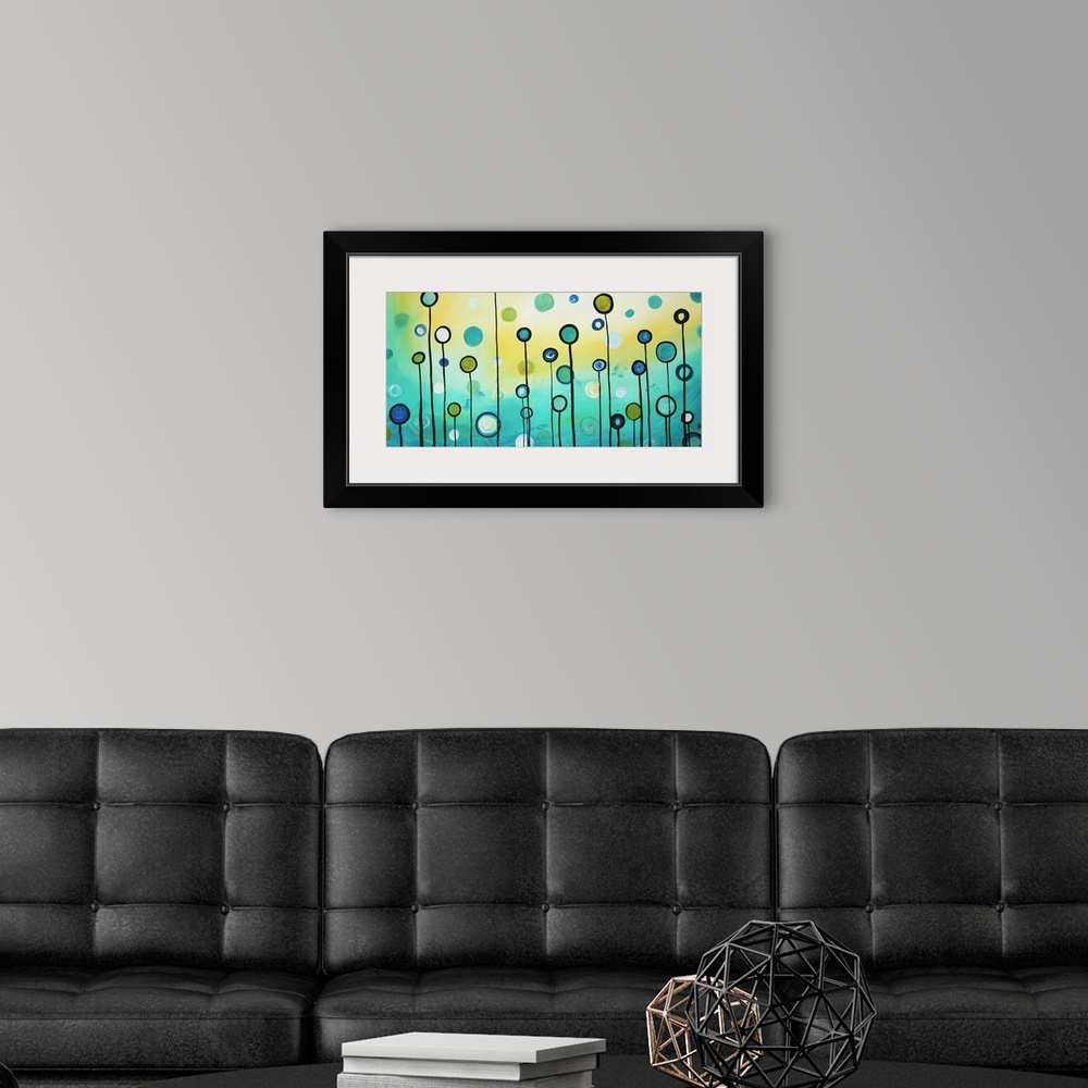 A modern room featuring Horizontal, large contemporary artwork for a living room or office of many circles in various col...