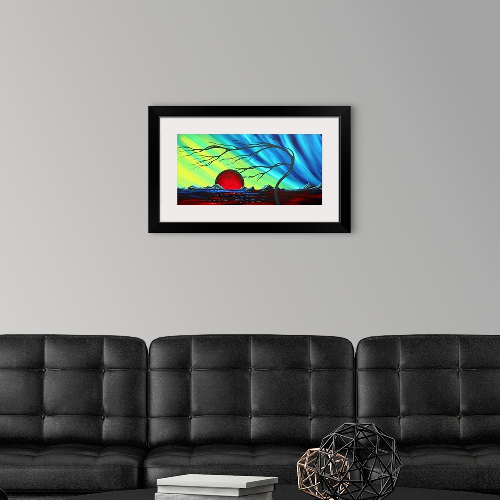 A modern room featuring Abstract artwork of a deep red sun that sits on the horizon with a cool colored sky above it. A f...