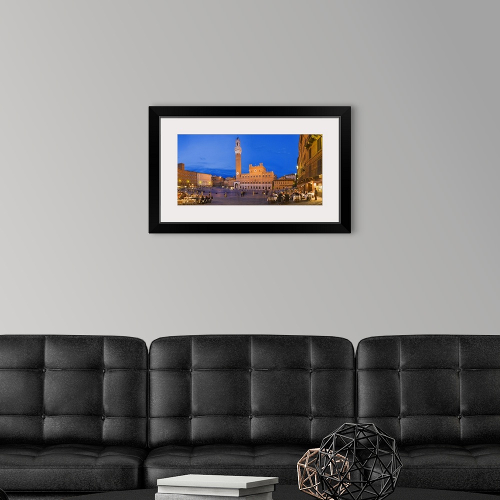 A modern room featuring This urban cityscape shows several outdoor cafes in public square surrounded by historic building...