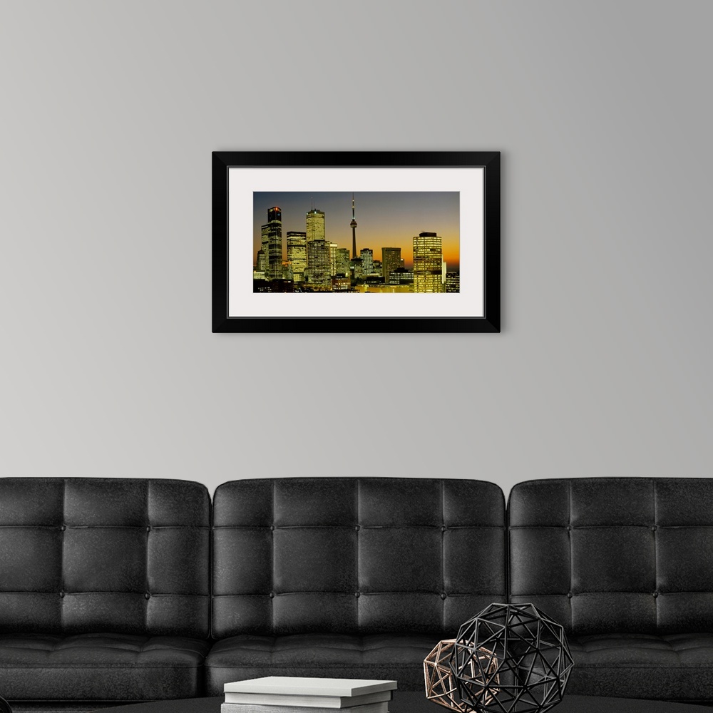 A modern room featuring Photograph of brightly lit buildings at night in Toronto, Canada, featuring Toronto Eaton Centre ...