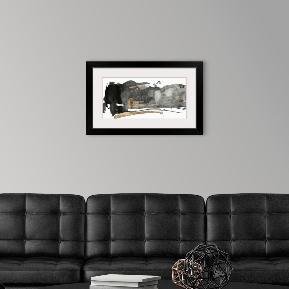 A modern room featuring Black and grey abstract artwork with golden streaks.