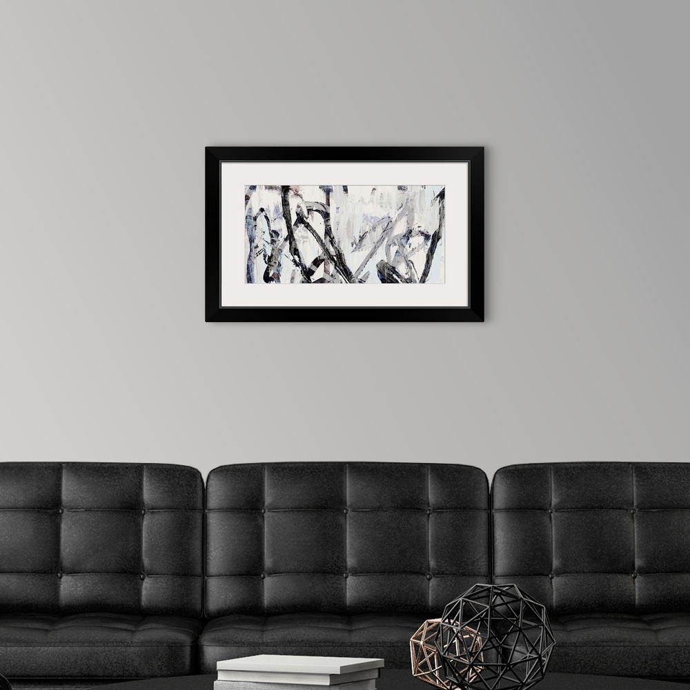A modern room featuring Contemporary abstract artwork in shades of grey and black.