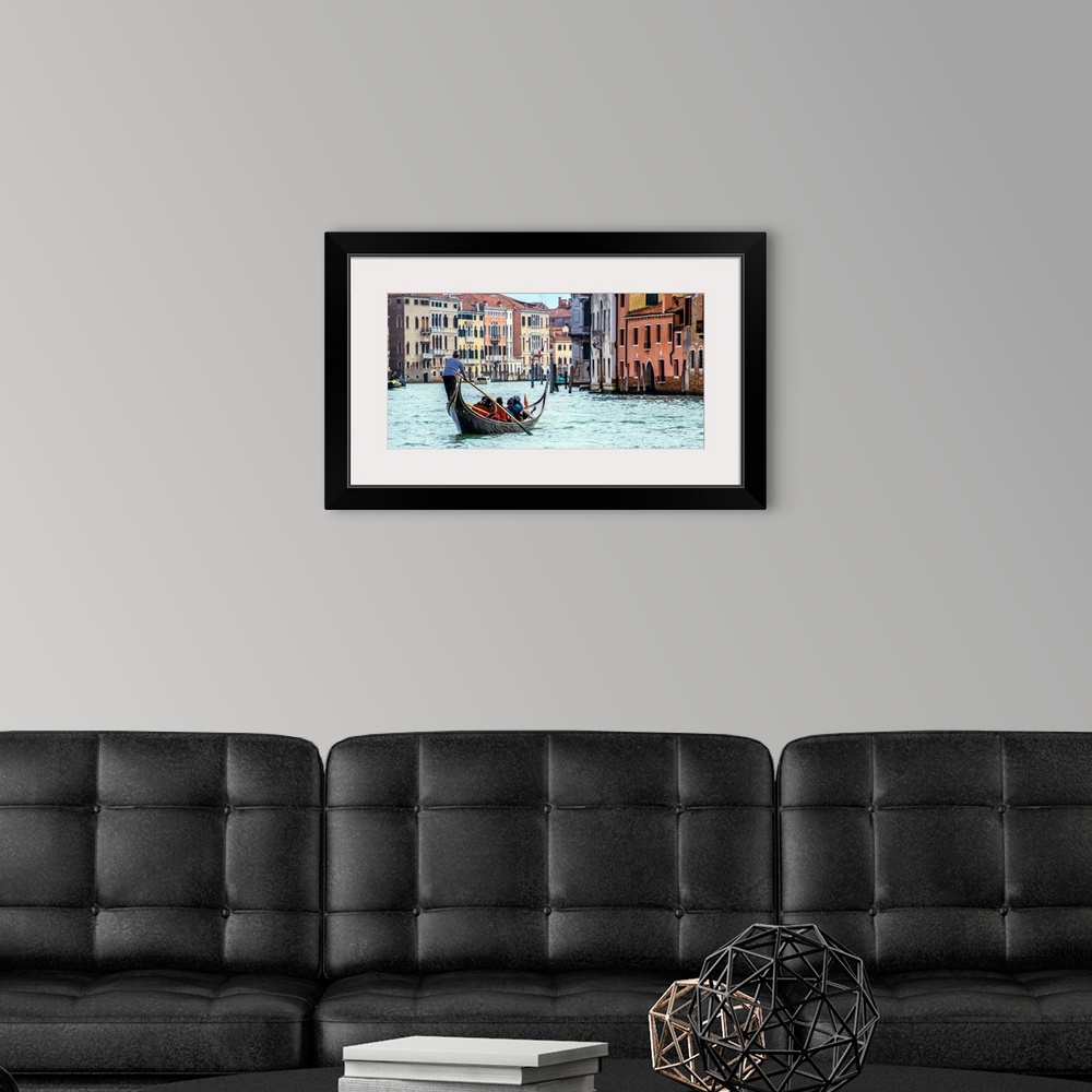 A modern room featuring Photograph of the rear side of a gondola rowing through Grand Canal in Venice.