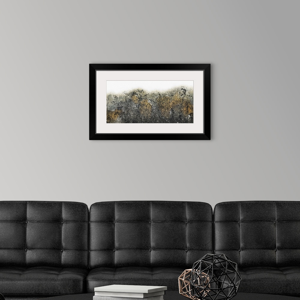 A modern room featuring Contemporary abstract painting with black, gold, and white paint splatter.