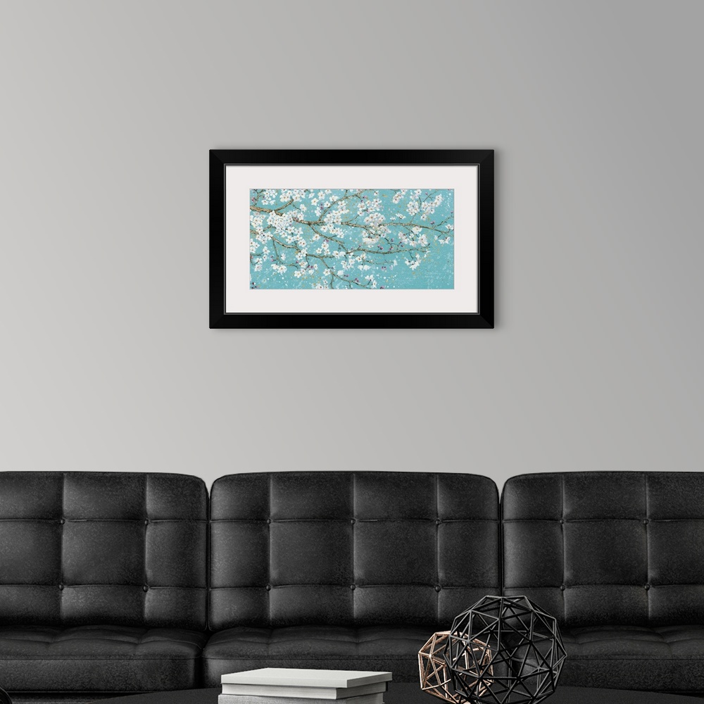A modern room featuring Contemporary painting of branches with white flower blossoms.