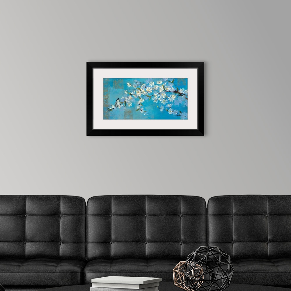 A modern room featuring Close up painting of a branch of blooming flowers against a cool background with additional ornat...