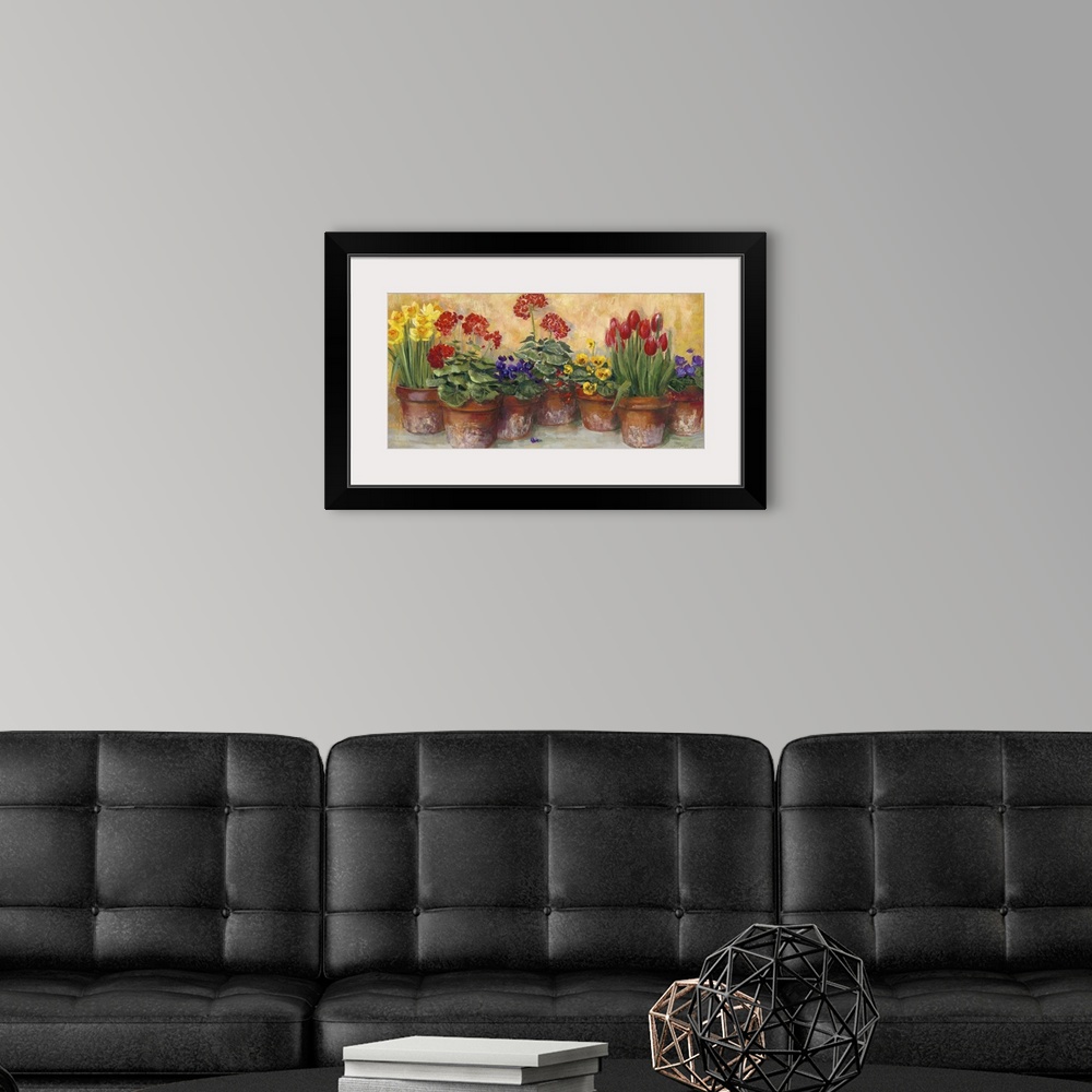 A modern room featuring A large horizontal painting of a row of potted flowers in warm colors.