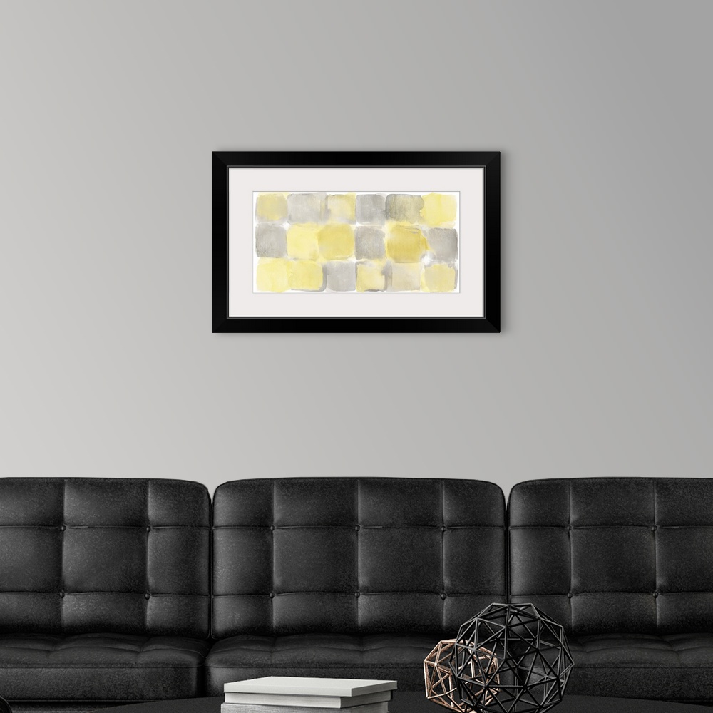 A modern room featuring Watercolor abstract painting of yellow and grey squares.