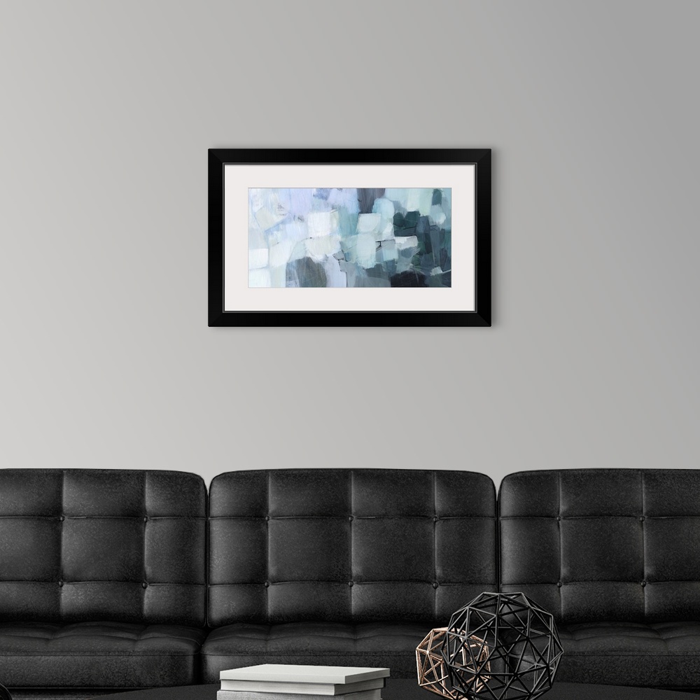 A modern room featuring A blocky, horizontal abstract image in seaglass shades of aqua, pale grey, light blue and dark te...