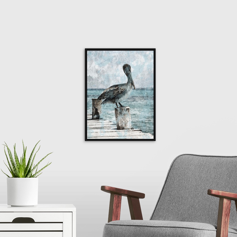 A modern room featuring Black and white photograph of a pelican standing on a dock with light blue tones painted on top.