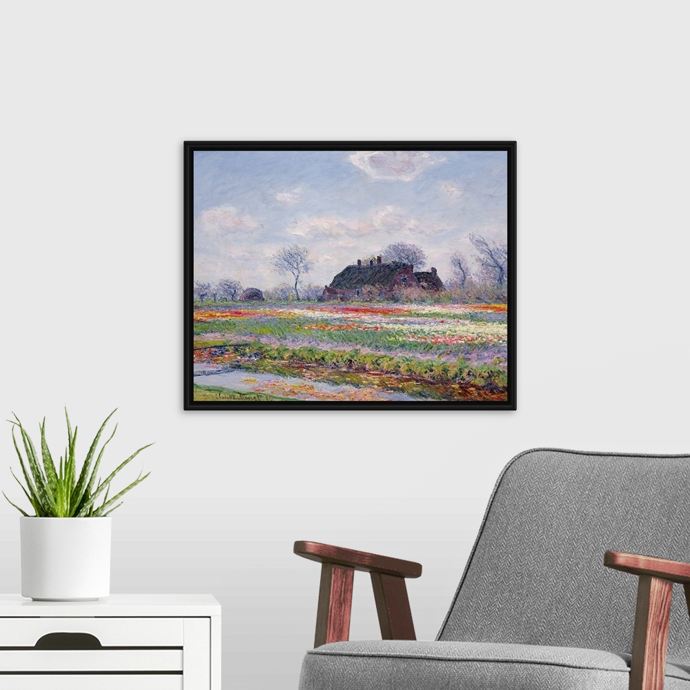 A modern room featuring Huge classic art depicts a field in the Netherlands covered in an array of brightly covered flowe...