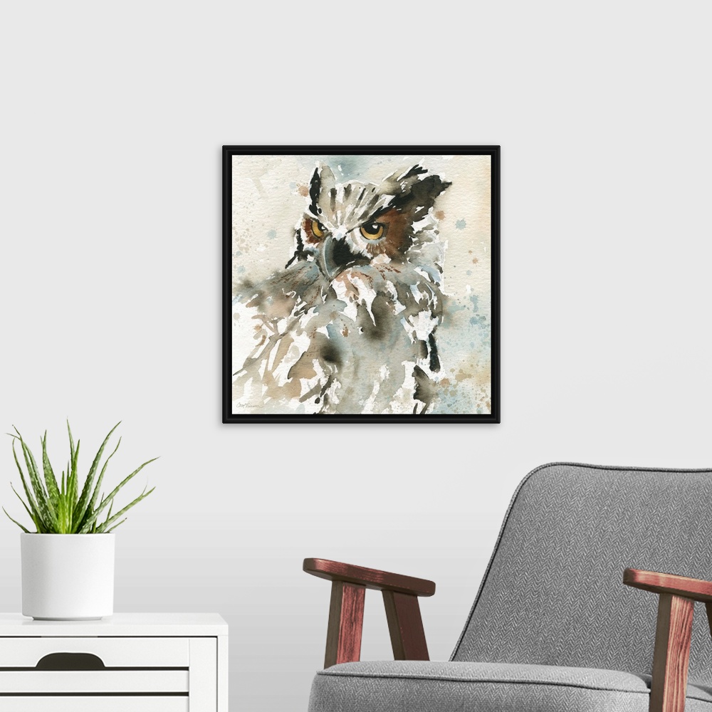 A modern room featuring A watercolor painting of an abstract owl with a neutral background that has paint splattered on it.