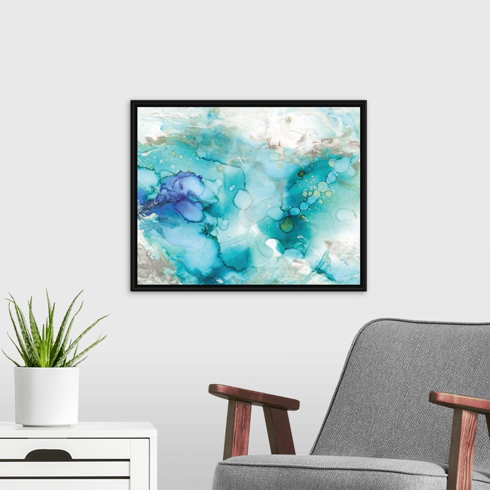 A modern room featuring Large abstract watercolor painting in shades of blue, grey, and green marbling together.