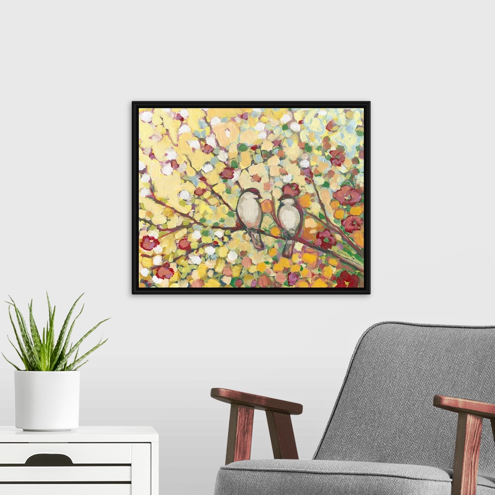 A modern room featuring Giant floral art displays two birds sharing a tree branch surrounded by colorful leaves and cherr...