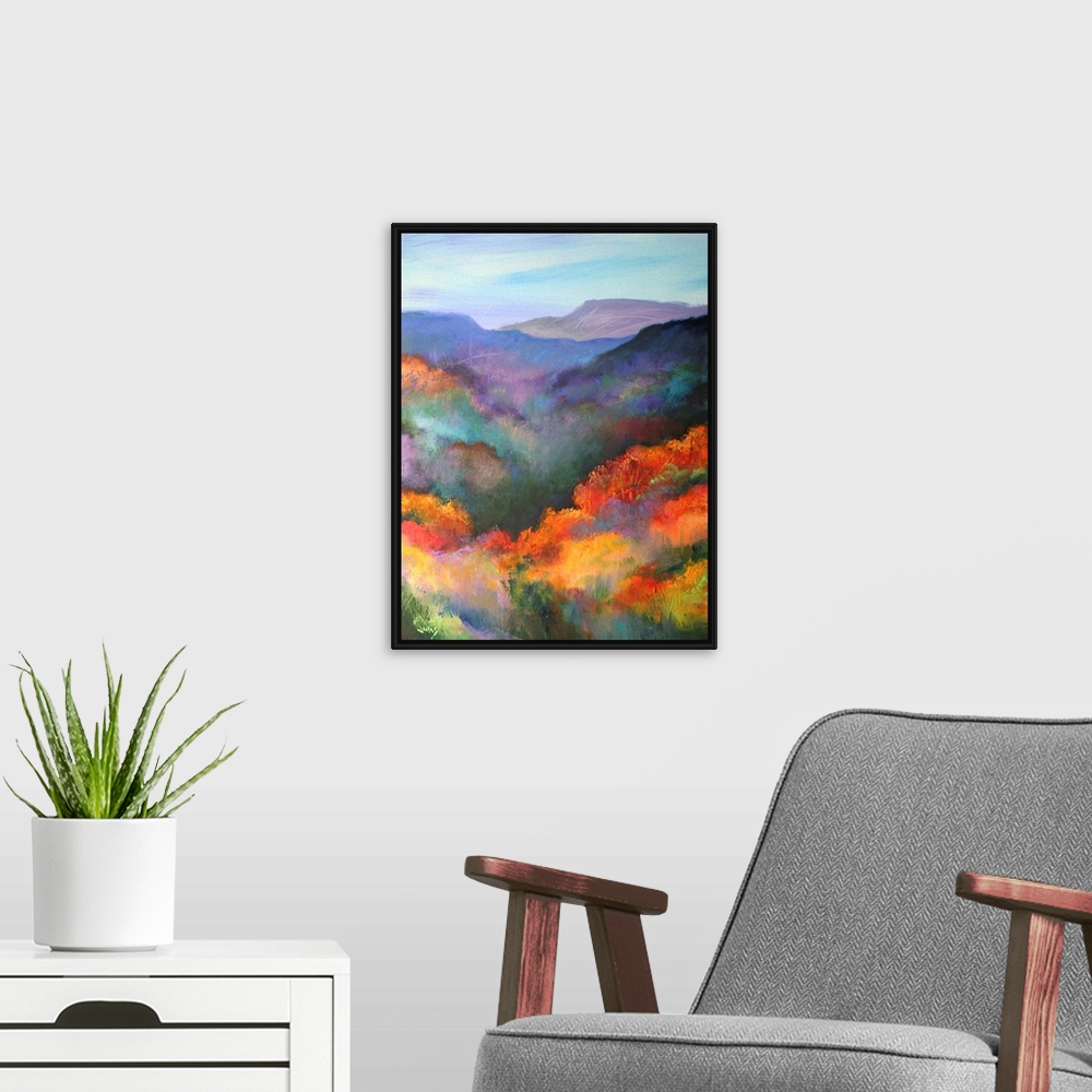 A modern room featuring Tall canvas painting of brightly colored trees with mountains in the distance.