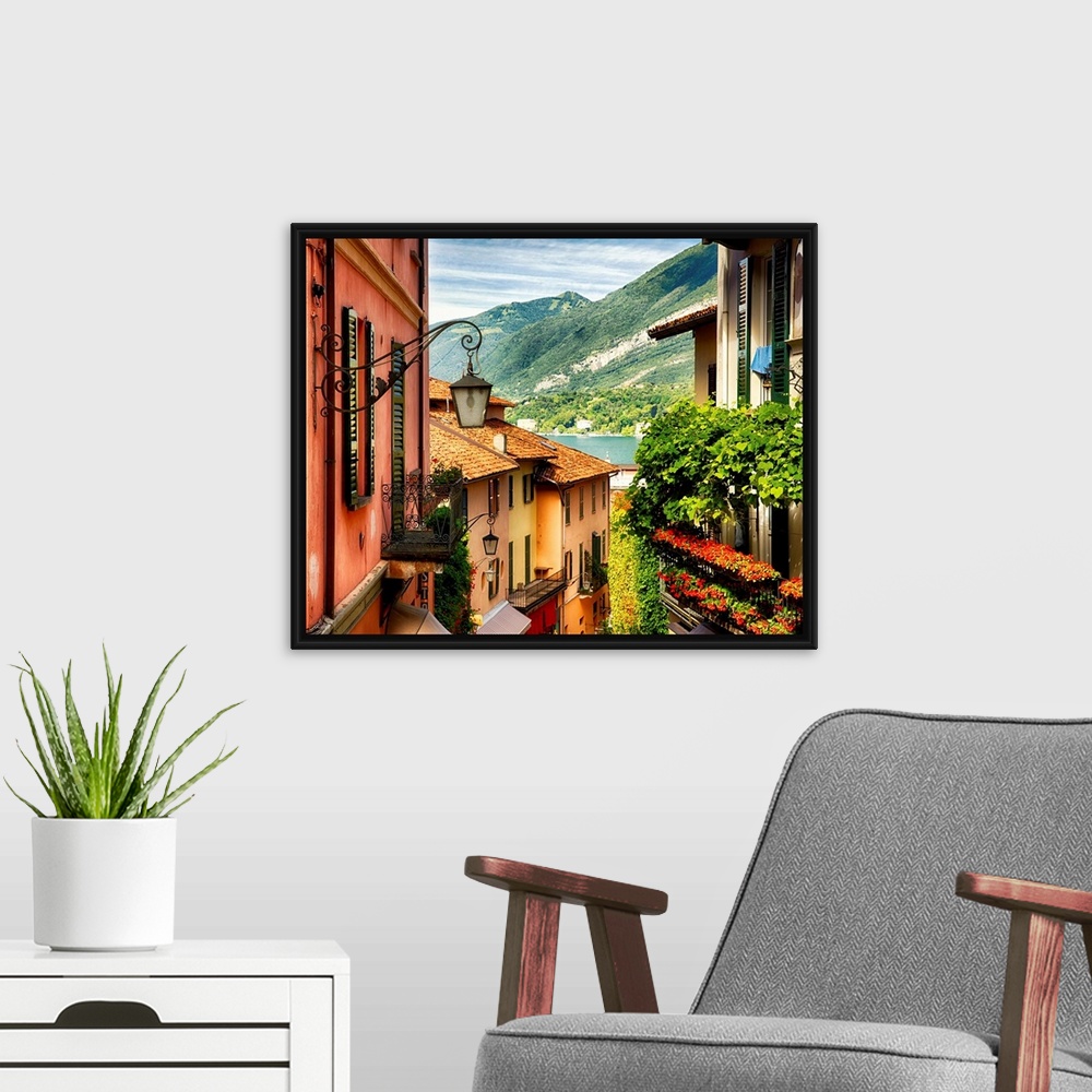 A modern room featuring Fine art photo of the roofs of shops in a European city, looking to the lake below.