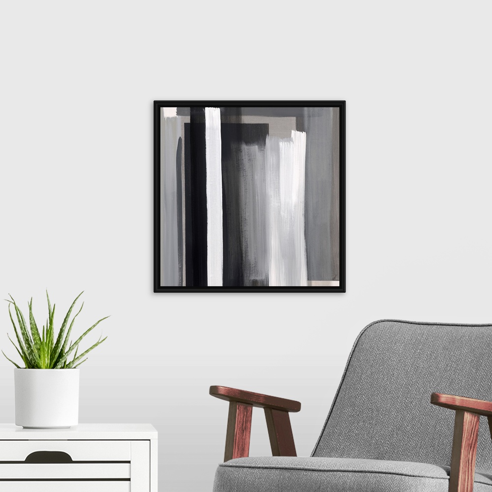 A modern room featuring Abstract artwork of layered color blocks in white and black.