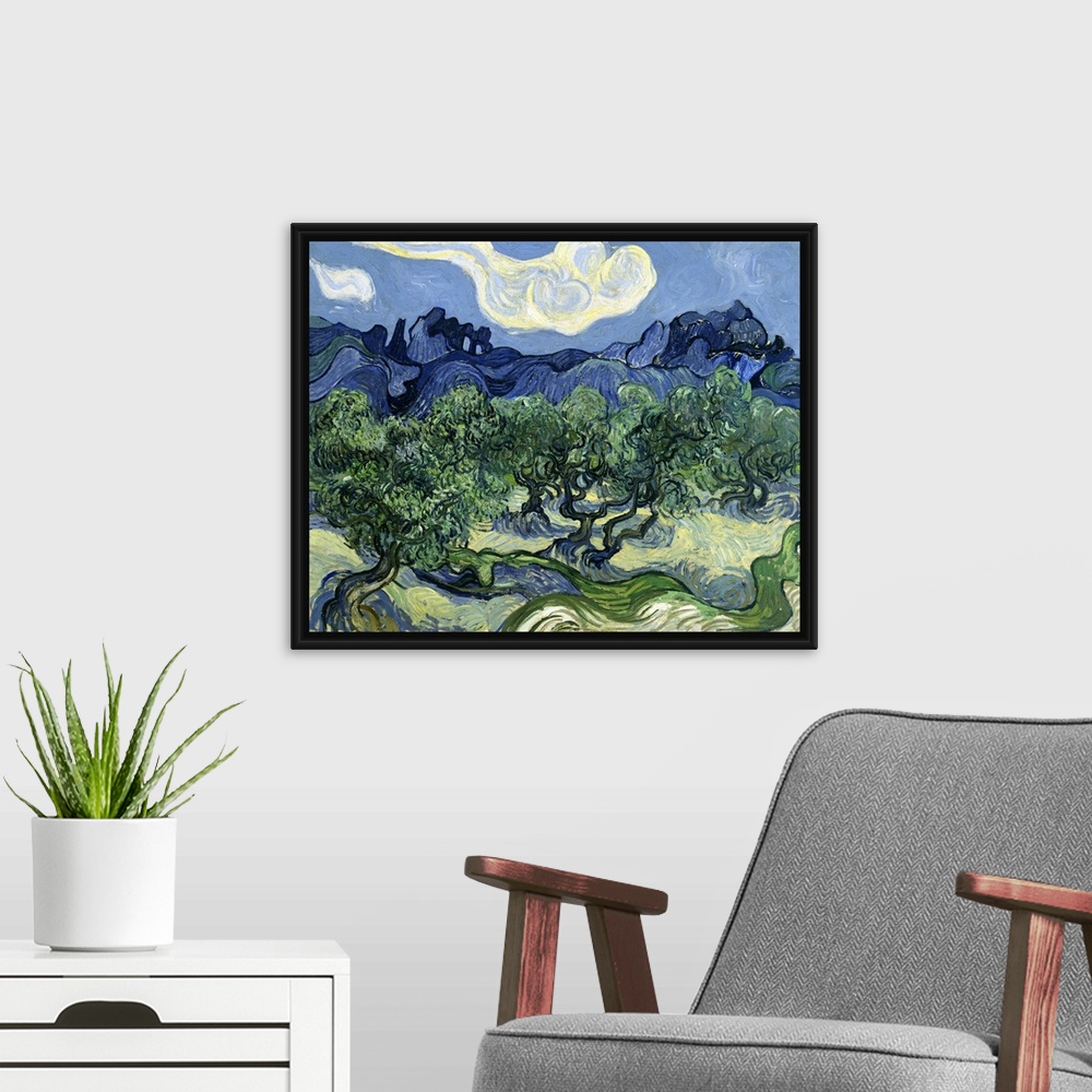 A modern room featuring Vincent van Gogh's Olive Trees with the Alpilles in the Background (1889) famous landscape painting.