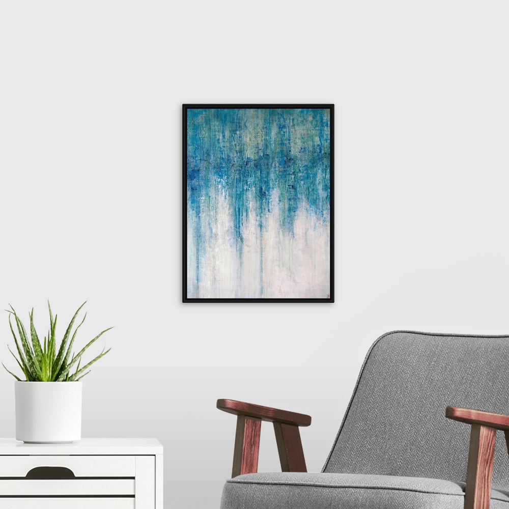 A modern room featuring Abstract artwork that has shades of blue color at the top that drip down toward the bottom which ...