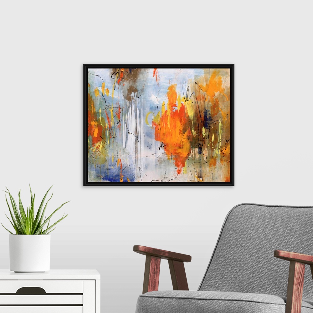A modern room featuring Abstract painting of bright colors mixed with earth tones to create depth.