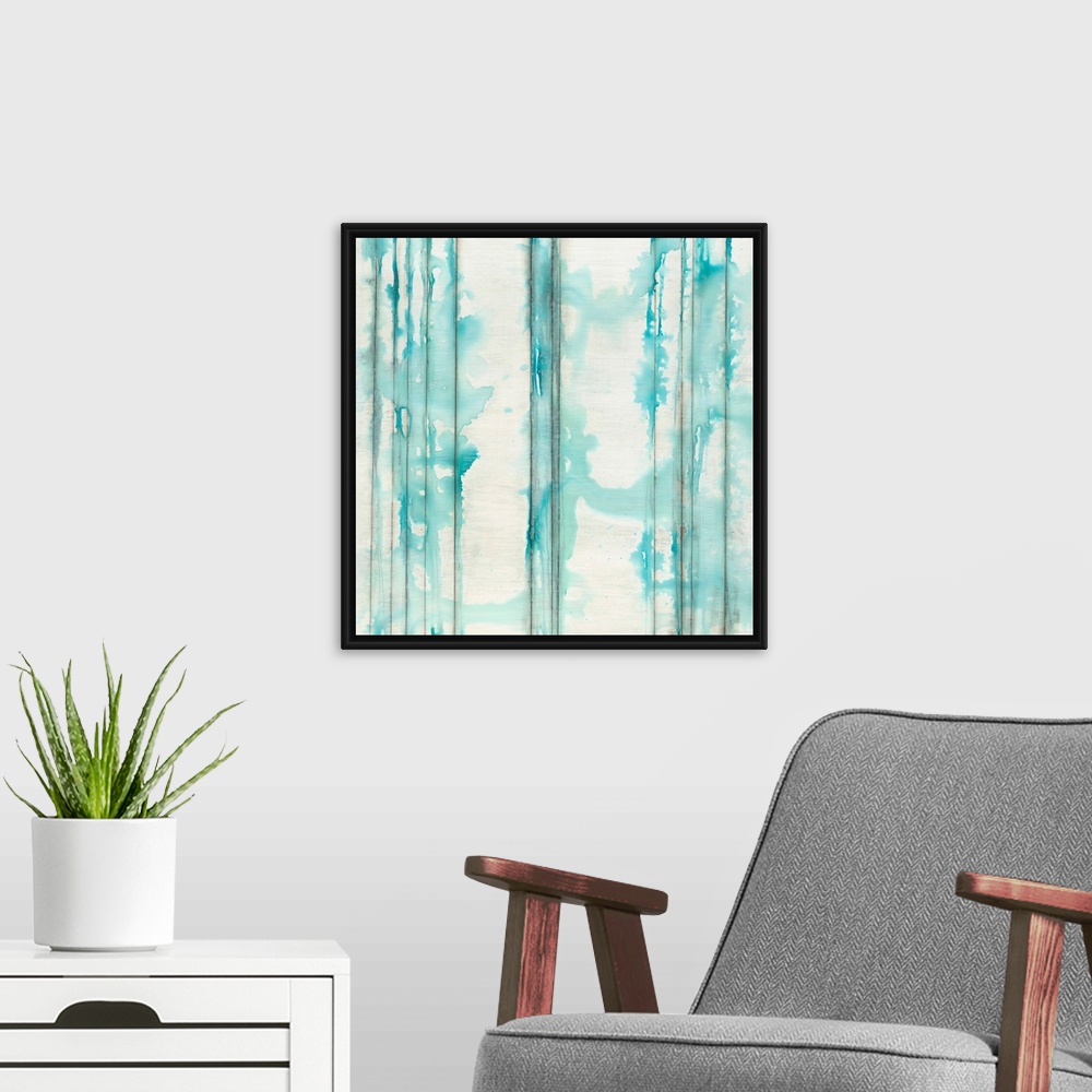 A modern room featuring Square abstractly painted canvas of vertical lines with splattered watercolor paint on top.