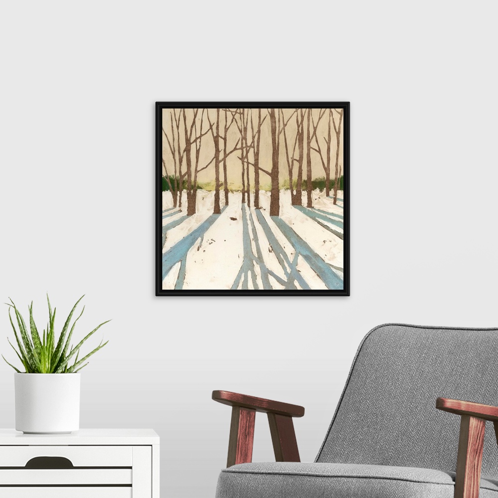 A modern room featuring Contemporary painting of a winter snowscape with the shadows of the trees in the foreground.