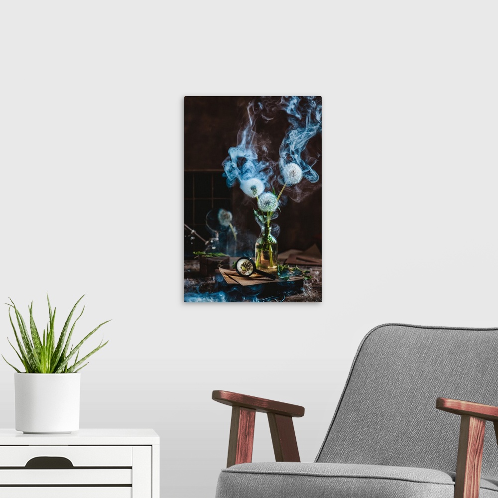 A modern room featuring Botanical still life with scientist's workplace, dandelions in a glass bottle and a blue smoke on...