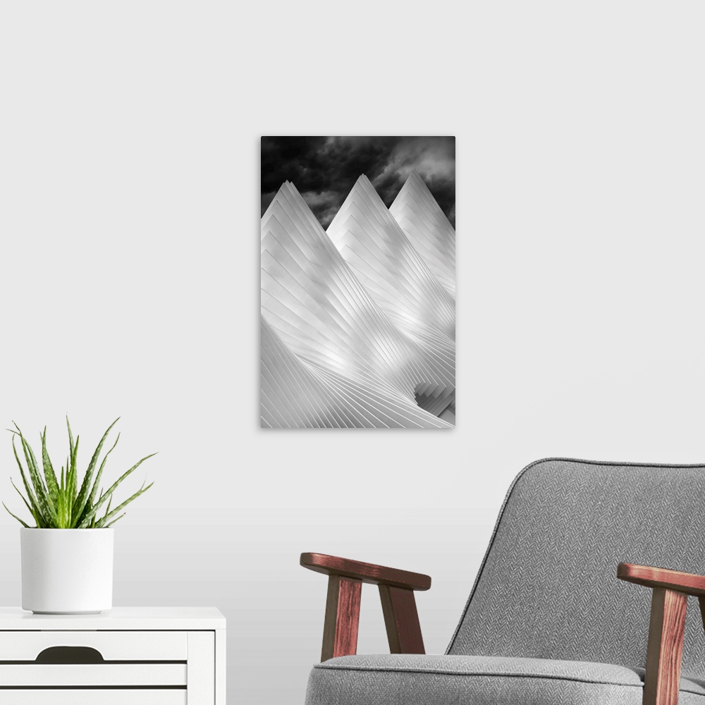A modern room featuring A black and white photograph of conical architectural attributes.