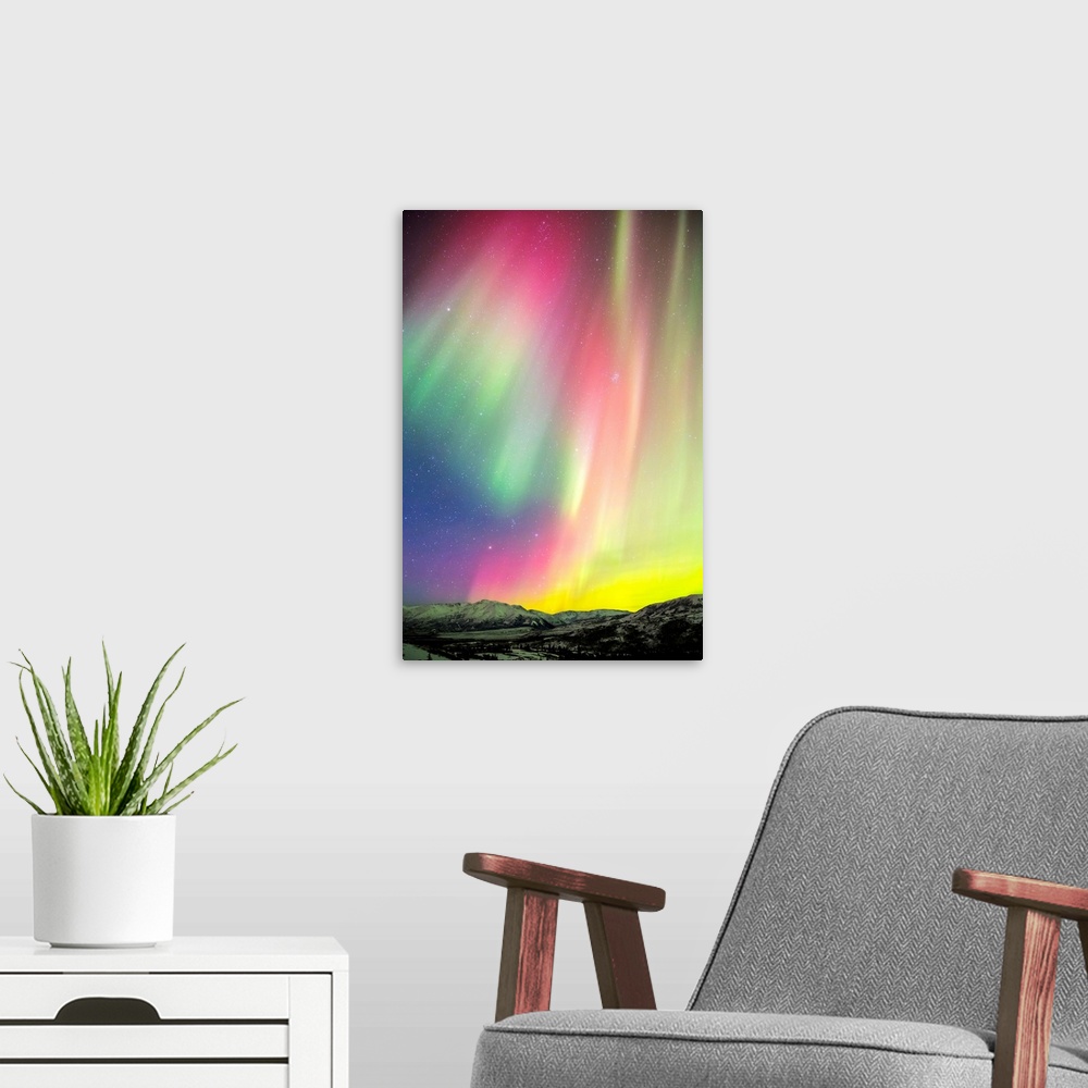 A modern room featuring A colourful aurora display over Granite Mountain, south of Delta Junction; Alaska, United States ...