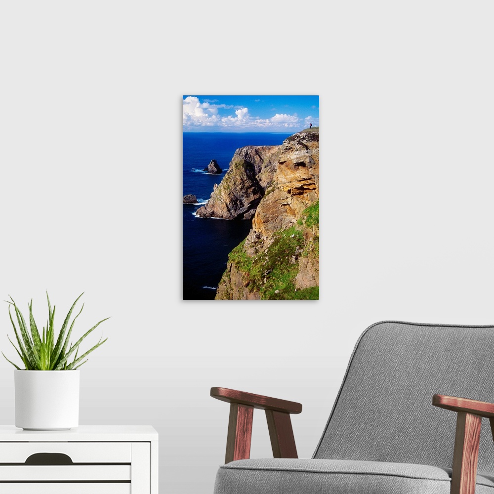A modern room featuring Arranmore Island, County Donegal, Ireland; Hiker On Coastal Cliff