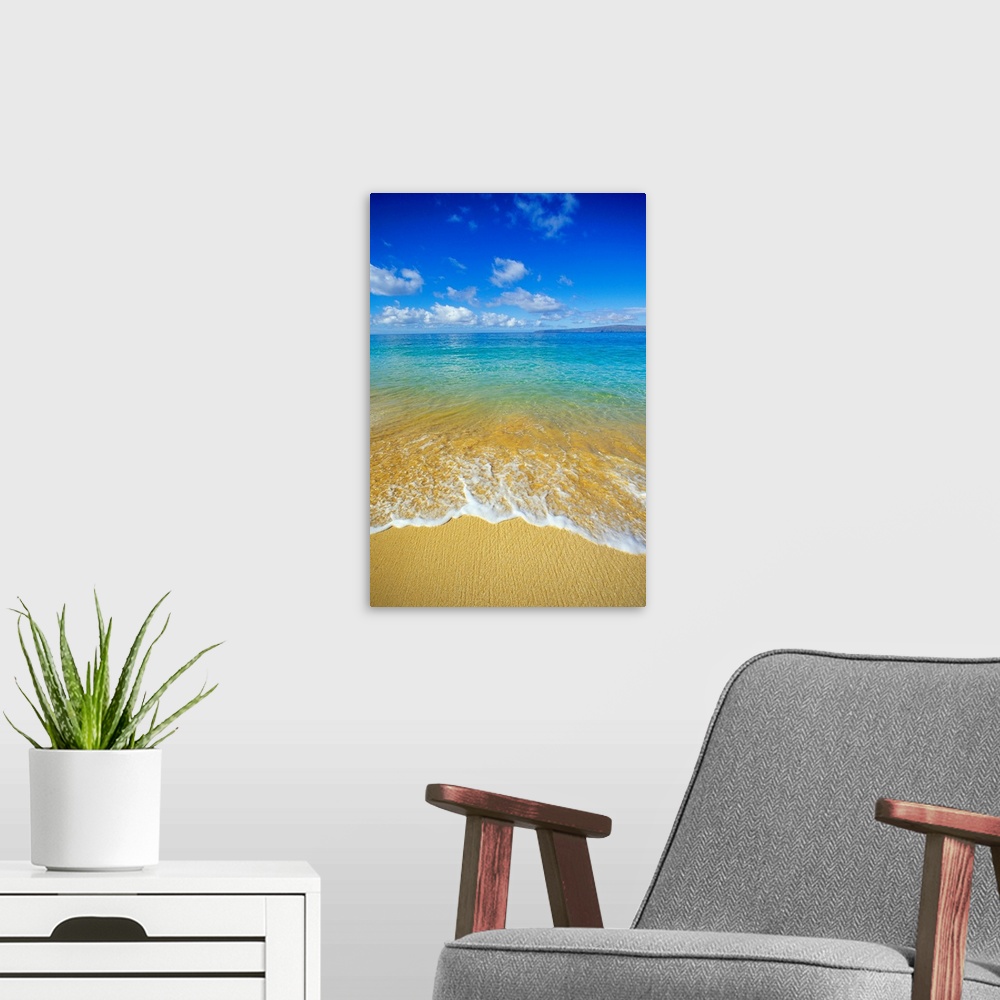 A modern room featuring Vertical photograph taken from the beach as water rushes upon it and a view out toward the vast c...